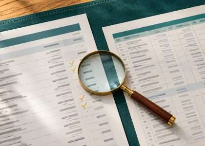 QuickBooks reconciliation difference illustrated by a statement and transaction records checked side by side.
